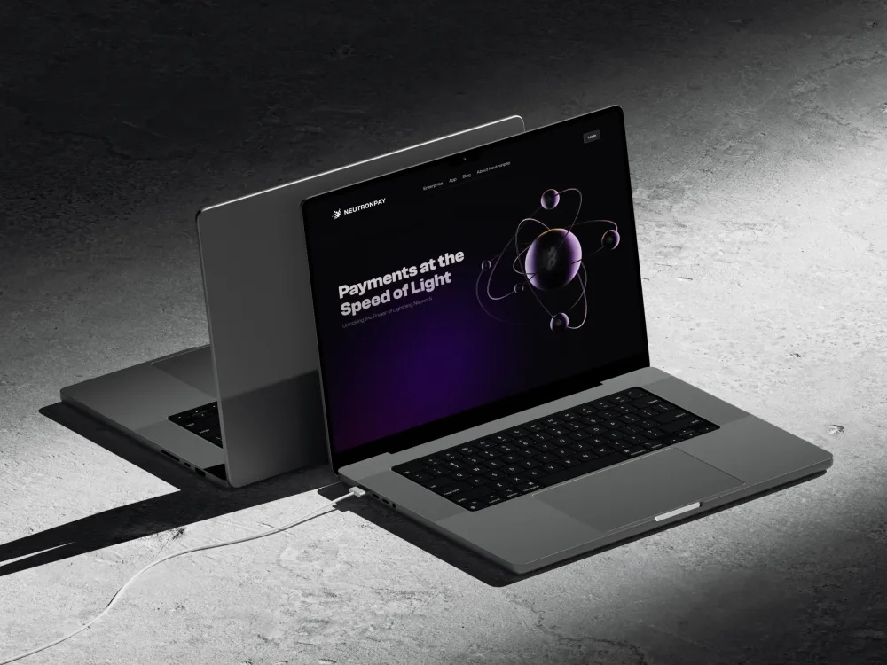 Neutronpay brand interface on laptop and mobile designed by XNOR Group for fintech branding identity